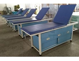 Examination table with drawers